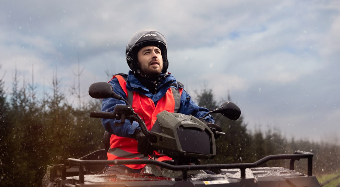 Apprentice technician driving a quad