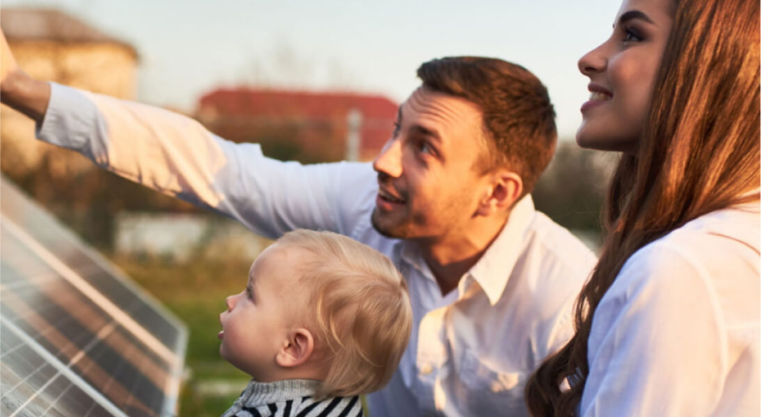 Family looking at a solar panel