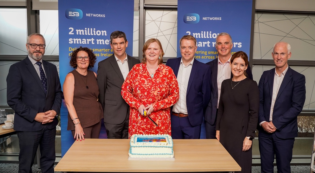 Image of eight people from ESB Networks and the Commission for Regulation of Utilities celebrating the two million smart meter installs milestone