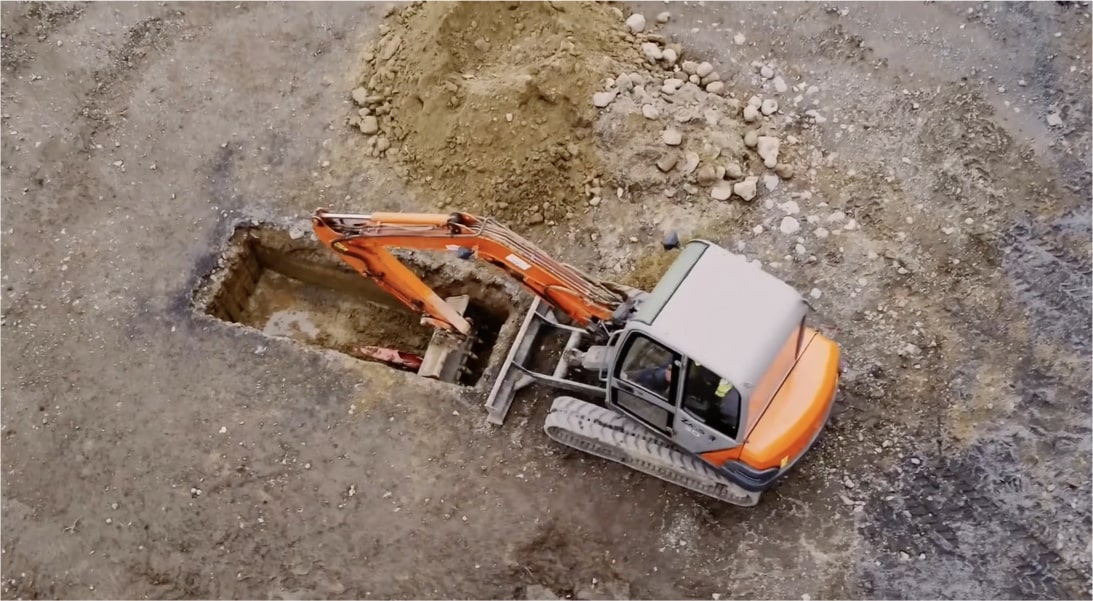 Machine digging ground