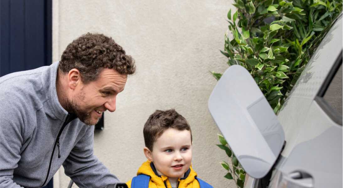 dad charging his car with his son