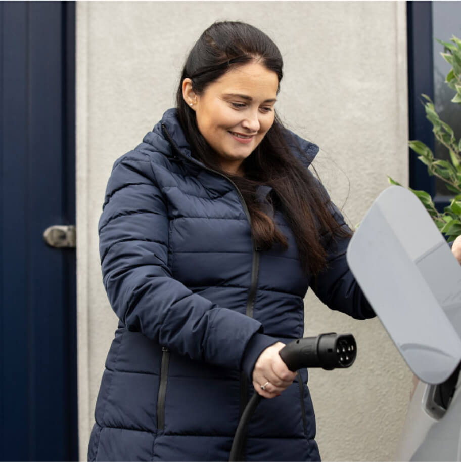 Woman charging ecar