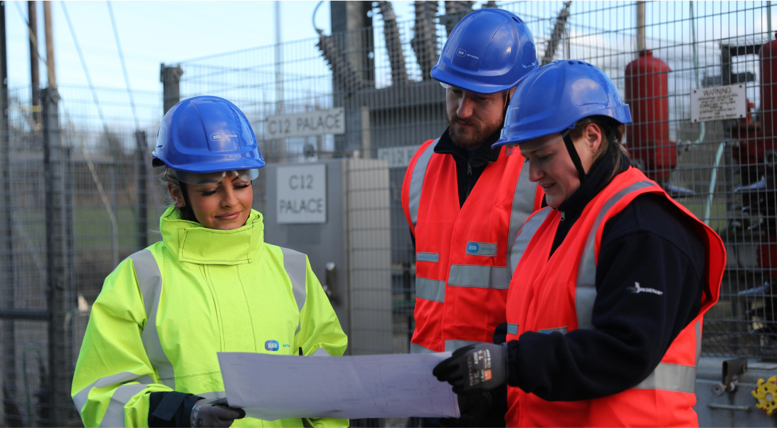 ESB Networks technicians looking at a paper