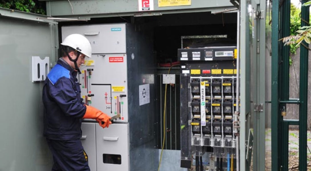 Technician looking at electrical installation