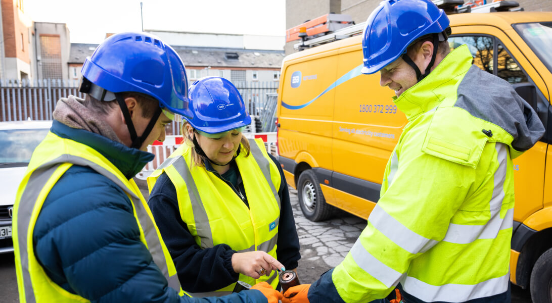 Technicians discussing of a cable