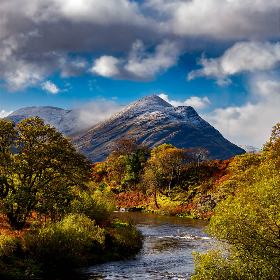 Irish landscape showing a mountain, trees and a river