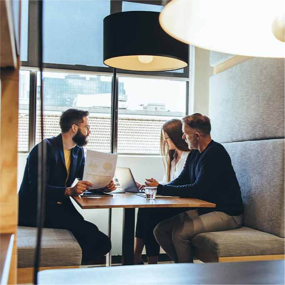 Business team sitting at a table and chatting