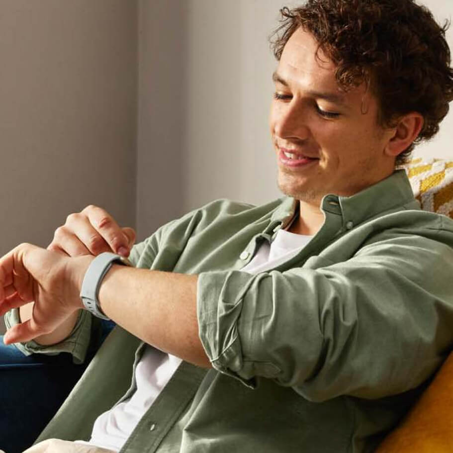 Man looking at his smartwatch