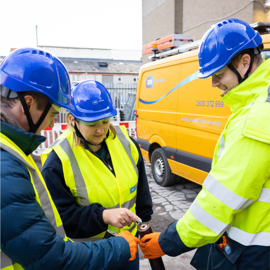 Technicians looking at cable