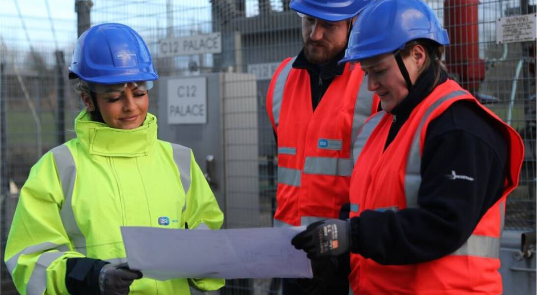 Technicians looking at a document