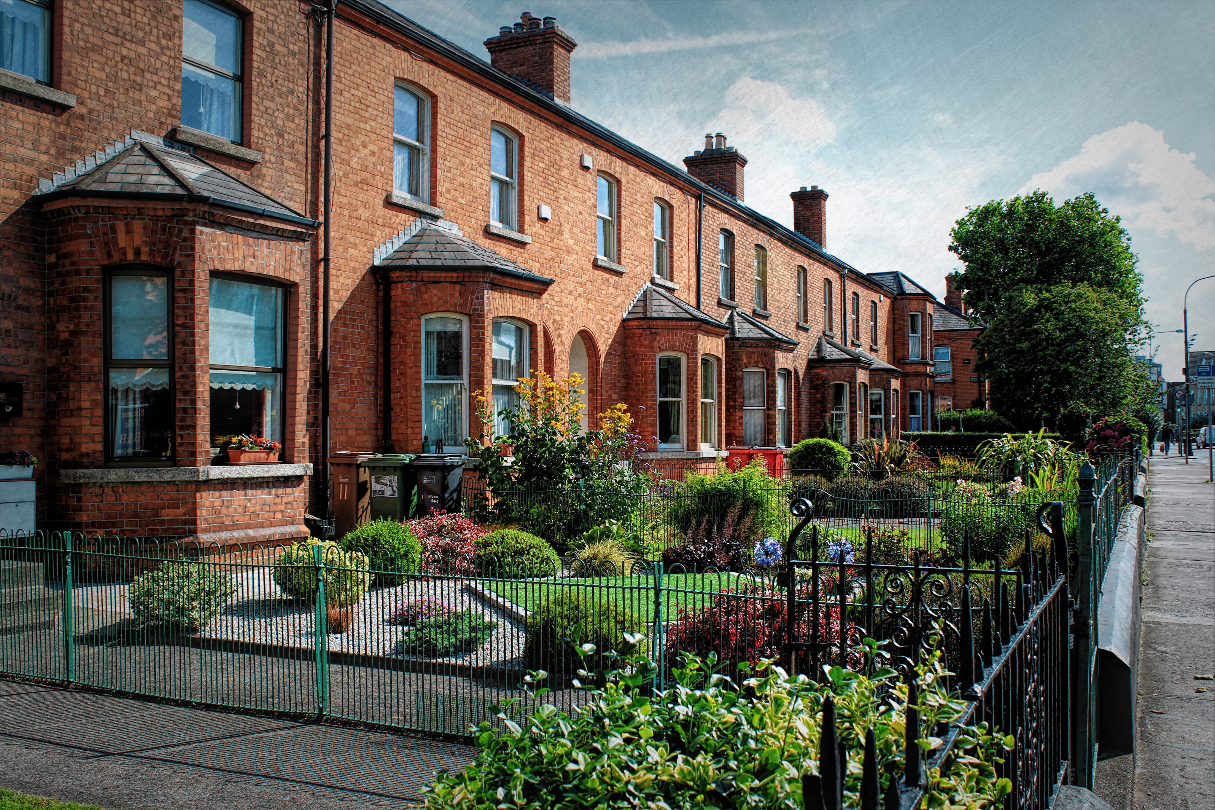 A row of red brick terraced houses.